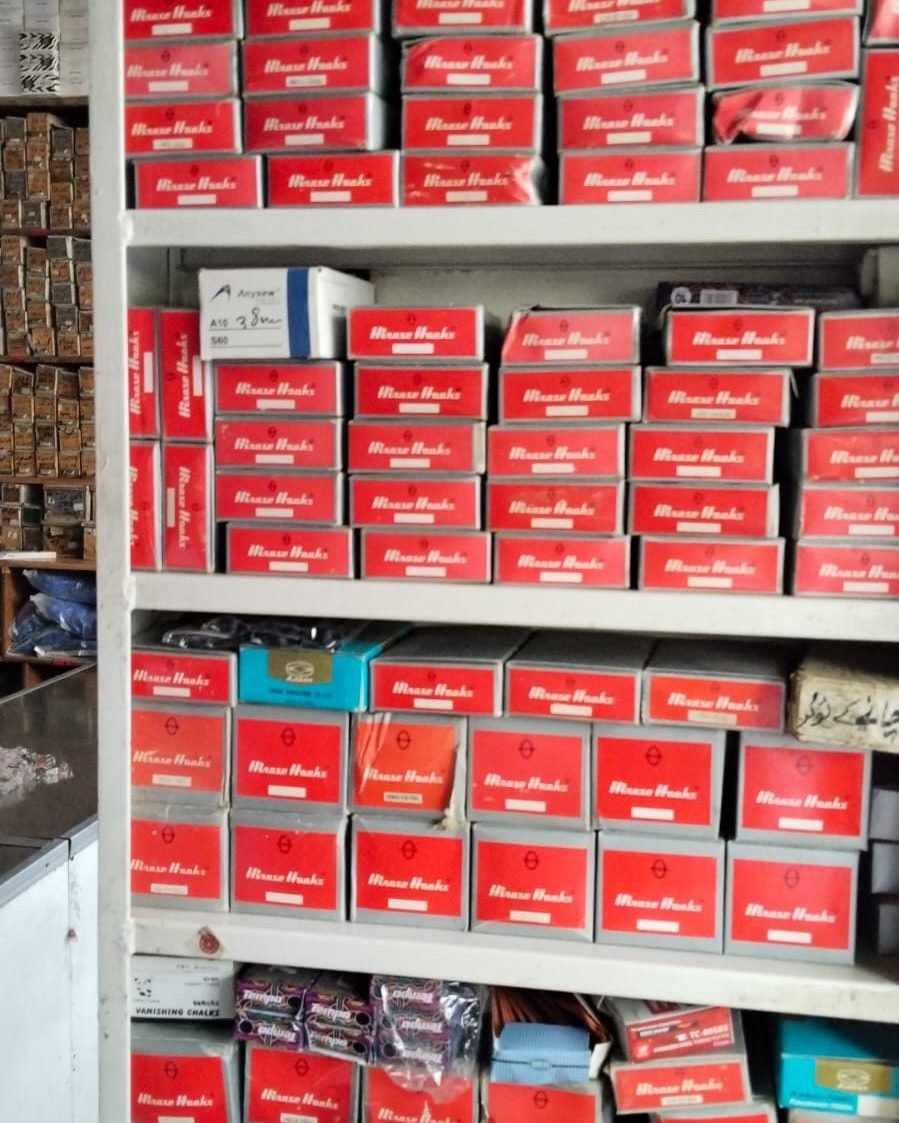 Shelves of boxed sewing machine parts at Babji Enterprises